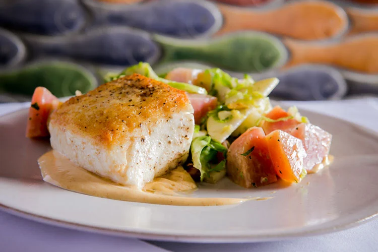 Casbah signature dishes Wild Alaskan Halibut, Casbah Double-Cut Pork Chop, Scottish Salmon, Filet Mignon